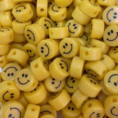 yellow beads with black eyes and smiling faces