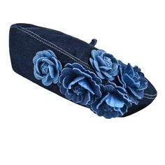 a denim hat with blue flowers on it