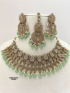 Gorgeous Antique gold Polki Necklace Set comes with beautiful earrings and tikka / Indian Jewelry/ High Quality Kundan and Polki Jewelry/ Bollywood Jewelry/Wedding Jewelry/mint/pista/sage green   All items are shipped from Brampton, Ontario, Canada. If you need your item by a certain day, please reach out to us for express delivery option before placing the order so that we can update the shipping for you. Standard shipping/delivery timeline Below are the estimated delivery times after the order Pista Green Jewellery Set, Bollywood Bridal Necklace With Green Stone Work, Green Bollywood Bridal Necklace With Stone Work, Bollywood Green Bridal Necklace With Stone Work, Bollywood Style Green Bridal Necklace With Stone Work, Green Bollywood Tikka With Intricate Design, Bollywood Green Tikka With Stone Work, Bollywood Style Green Tikka With Stone Work, Heavy Green Tikka For Party