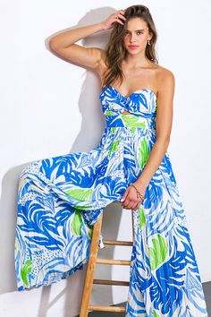 A printed woven jumpsuit featuring sweetheart neckline, center cut out, pleated pant and smocked back bodiceDetails:Self : 100% PolyesterLining : 100% PolyesterSize & Fit- Model is 5`9" And Wearing Size Small- Measurements Taken From Size Small- Approx. Length: 52" Spring Vacation Strapless Jumpsuit With Smocked Bodice, Blue Sleeveless Jumpsuit With Smocked Back, Sleeveless Blue Jumpsuit With Smocked Back, Blue Strapless Wide Leg Jumpsuit For Summer, Blue Strapless Jumpsuit For Spring Day Out, Blue Jumpsuit With Smocked Back, Blue Strapless Jumpsuit For Spring Vacation, Blue Vacation Jumpsuits And Rompers With Smocked Bodice, Blue Jumpsuits And Rompers With Elastic Waistband For Vacation