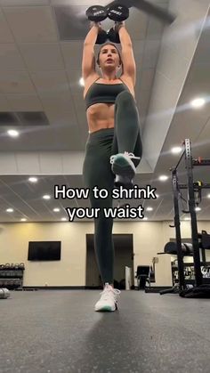 a woman doing an overhead pull up with the caption how to shrink your waist