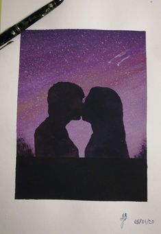 a couple kissing in front of a night sky