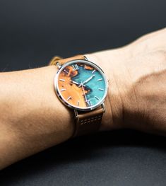 Introducing our Epoxy Resin Watch with Leather Strap - a stunning timepiece that combines style, artistry, and personalization. ⌚ Unique Elegance: This watch is a true work of art. The mesmerizing blue epoxy resin design beautifully complements its precision timekeeping. Wear a watch that makes a statement. ⌚ Luxurious Leather: The genuine leather strap adds a touch of luxury to this exquisite timepiece. It's not just about looks; it's also about comfort. It ensures that you experience sophistic Multicolor Analog Watches For Gift, Multicolor Analog Watches As Gift, Gift Multicolor Analog Watches, Blue Watch Accessories For Gift, Blue Analog Watch Accessories As Gift, Turquoise Quartz Watch For Gifts, Teal Suit, Resin Watch, Groomsmen Gifts Personalized