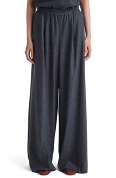 Floor-sweeping cuffs give dramatic sophistication to these office-ready pants cut from a stretchy blend of breathable wool and plush cashmere. 32" inseam; 32" leg opening; 11 1/2" front rise; 15 1/2" back rise (size Medium) Elastic waist 90% wool, 8% cashmere, 2% elastane Side-seam pockets Dry clean Made in the USA Elegant Full Length Cashmere Pants, Cashmere Wide-leg Work Pants, Elegant Gray Wool Bottoms, Cashmere Bottoms For Workwear, Chic Cashmere Workwear Pants, Chic Cashmere Pants For Work, Elegant Gray Wide Leg Pants For Fall, Elegant Cashmere Wide-leg Pants, Elegant Wide-leg Cashmere Pants