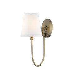 a wall light with a white shade on the side and a gold finish to it