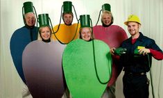 five people dressed up in costumes and hats