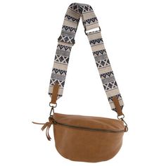 Take your odds and ends on the go with this Brown Pouch With Geometric Strap! This stylish crossbody pouch is made of faux leather with a light brown finish. The tassels on its zippers and the navy and cream geometric pattern on its strap give it a southwest-inspired look. Use it to carry makeup, accessories, cards, cash, and more! Details: 	 Length: 5 3/4" 	 Width: 10" 	 Thickness: 3 1/4" 	 Strap Drop Length: 15 1/2" Chanel Fashion Show, Brown Crossbody Bag, Faux Leather Bag, Odds And Ends, Brown Crossbody, Chanel Fashion, Leather Zipper, Leather Design, Makeup Accessories