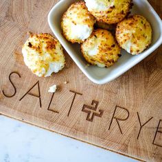 some food is sitting in a bowl on a cutting board with the word saltry