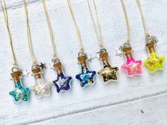 six different colored glass stars on gold filled necklaces