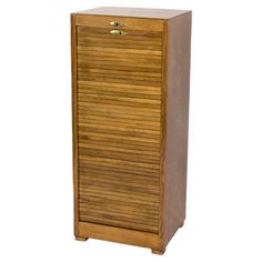 a tall wooden cabinet with drawers on top