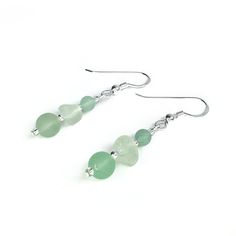 Delicate sea glass drop earrings. The earrings are handmade with aqua green Scottish beach glass, frosted Aventurine crystal beads, sterling silver beads and Czech glass beads. The earrings include nuggets of genuine sea glass, worn smooth and frosted in the Scottish sea. This pale green colour is evocatively known as 'sea foam'. The earrings measure 4cm in length from the top of the hook. Photographs are a guide. You won't receive the exact earrings pictured but they will be very similar and guaranteed to be a one-off! The sea glass used in these earrings is collected from the coastline of the East Neuk of Fife in Scotland, making each pair truly unique and special. The subtle variations in colour and texture add to the organic and natural feel of the earrings. The earrings arrive in a gi Scottish Beach, Aventurine Jewelry, Silver Bead Earrings, Green Aventurine Crystal, Aventurine Crystal, Glass Drop Earrings, Dangly Earrings