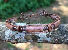 Jasper Tube Beads on a square copper wire bracelet.This bracelet has been oxidized, polished and sealed to prevent tarnishing. Sealed with Protectaclear. ProtectaClear is a clear, protective coating that is tough enough to protect jewelry and is safe for wear against skin. ProtectaClear is practically invisible once applied and will seal and protect jewelry from tarnish, oxidation, and corrosion Adjustable Copper Bracelets For Healing, Adjustable Rustic Copper Bracelets, Adjustable Rustic Copper Bracelet, Adjustable Rectangular Bronze Jewelry, Brown Copper Wire Wrapped Bracelets, Copper Wire Bracelet, Chain Ideas, Altered Jewelry, Accessory Design