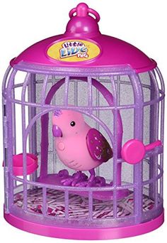 a toy bird in a purple cage on top of a white surface with pink accents