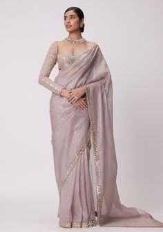 Elevate your style with our exquisite pink organza saree with a mirror blouse set. This stunning ensemble features a beautiful pink organza saree adorned with intricate hand-cut mirror embroidery. The saree is complemented by a full-sleeve sweetheart neckline blouse, also embellished with delicate mirror embroidery. Step into any occasion with confidence, as this saree set effortlessly combines elegance and sophistication. Make a statement and turn heads wherever you go with this mesmerizing piece. Composition : Saree - Organza, Blouse - Georgette Care: Dry Clean Only and Vacuum Storage This product can be customized for sleeves, length and colour Delivery : 6-8 weeks as the product is hand crafted. Check Size Guide or choose MySize for free customisation (All Sizes above XL can be made at Pink Organza Saree, Vine Embroidery, Ash Pink, Organza Blouse, Indian Wedding Wear, Dress Chiffon, Organza Saree, Lace Border