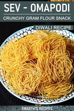 two bowls filled with yellow noodles on top of a black table next to each other