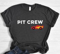 a t - shirt that says pit crew with a fire car on the front and back