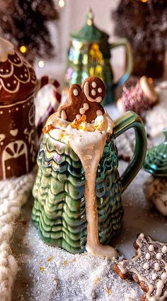 there is a mug with some food in it on the table next to other decorations