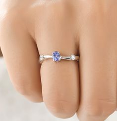 Natural Tanzanite Ring, Tanzanite Jewelry, Silver Ring, Boho Ring, Statement Ring, Gift for Her, Artisan Ring, Christmas Sale, Mom Gift Ring S T O N E ∙ D E T A I L S *Gemstone: tanzanite *Gemstone Type: Natural *Gemstone Shape: Oval (4*5) *Number of Gemstones: 1 *Gemstone Weight:0.42 Cts *Gemstone Grade: AAA *Accent Stones: Cubic Zirconia M E T A L ∙ D E T A I L S  *Metal Color: Rose Gold, Yellow Gold, White Gold *Metal: 925 Silver, 10k, 14k, 18k *Ring Size measure: Sizeable 4-14 US  *Setting: Gift Tanzanite Diamond Ring With Round Cut, Tanzanite Round Cut Diamond Ring Gift, Oval Tanzanite Diamond Ring For Gift, Tanzanite Diamond Ring Gift Round Cut, Gift Tanzanite Diamond Ring Round Cut, Oval Tanzanite Diamond Ring As A Gift, Round Cut Tanzanite Diamond Ring Gift, Tanzanite Ring With Round Band For Gift, Stackable Sapphire Rings With Accent Stones As Gift