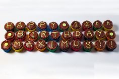 there are many cupcakes with the words happy birthday maximus written on them in gold letters