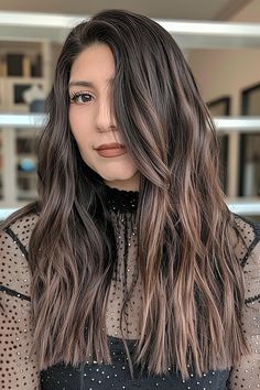 Woman with long, dark brown straight hair featuring choppy textured ends Modern Style