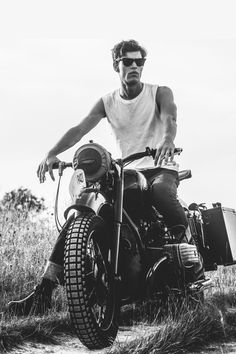 a man riding on the back of a motorcycle