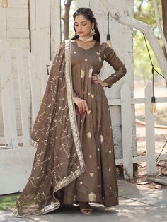 Introducing the stunning "attractive brown embroidered silk festival wear gown with dupatta" from Ethnic Plus. This gorgeous gown is perfect for any festival, event, or special function. Made from luxurious silk fabric, it features rich sequins and intricate embroidered work, giving it a truly elegant and sophisticated look.
This brown gown includes a beautifully rich color, a fully stitched design for convenience, and a matching silk dupatta with the same sequins and embroidery detail. The gown Punjabi Wedding Dress, Long Anarkali Gown, Wedding Dresses Pakistani, Lehenga Crop Top, Gown With Dupatta, Saree Bollywood, Lehenga Choli Wedding, Reception Gown, Designer Gown