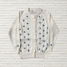 "Vintage 70's Floral Embroidered Cardigan Sweater  white acrylic button up cardigan sweater  light blue flower embroidery  raglan cut  good condition Brand: Petronelli  approx size xs/s cottage core vibe Flat Lay Measurements: Length: 23.5\" Pit to pit: 19\" Sleeve Length (pit to cuff): 16\"" Embroidered Cardigan, Light Blue Flowers, White Cardigan, Floral Vintage, White Sweaters, Jumpers And Cardigans, Floral Embroidery, Vintage 70s, Cardigans For Women