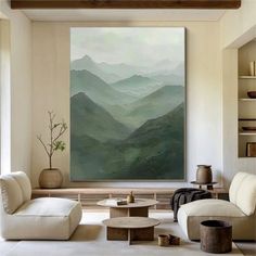 a living room filled with furniture and a painting on the wall