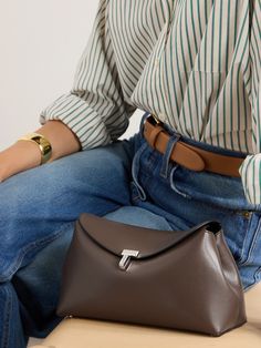 You can consider TOTEME's 'T-Lock' clutch an all-rounder - it works with smart and casual outfits alike. Made from leather, the compact accessory opens to reveal space for the essentials - think your phone, cardholder, keys and lip gloss - and has silver-tone hardware, including the protective feet at the base. Clutch Outfit, Denim Flats, Eyewear Shop, Flat Dress Shoes, Floral Dresses Short, Dress Flats, Sport Swimwear, Jo Malone London, Swimsuit Dress