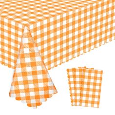 an orange and white checkered table cloth