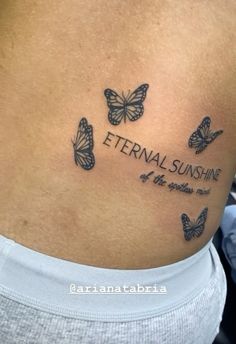 a woman's stomach with butterflies and the words, eternal sunshine on her side