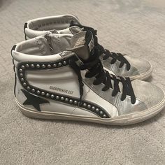 Worn Twice Like Brand New. White With Silver Studs And Black And Silver Trim Leather. White High-top Sneakers With Studded Outsoles, Designer High-top Sneakers With Removable Insole, Luxury High-top Sneakers With Removable Insole, Silver Leather Custom Sneakers With Round Toe, Custom Silver Leather Sneakers With Round Toe, Chic Leather Sneakers With Studded Rubber Outsoles, Chic White Flat-heeled Sneakers, Silver Leather Sneakers With Flat Heel, Silver Leather Flat Heel Sneakers