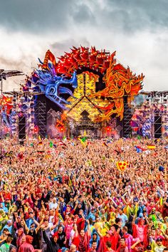 a large group of people standing in front of a stage