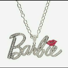 Barbie Bling Nameplate Necklace , Sold Out Wake Up And See The Sparkle! This Barbie Necklace Is Perfect For Your Next Malibu Ootd. It Features The Iconic Barbie Logo Bejeweled With Cz Gems, With A Sparkly Pink Lip On The "I." Nameplate: 4 1/2" Chain: 16" Alloy; Acrylic Imported Personalized Silver Necklaces For Party, Personalized Silver Necklace For Party, Trendy Silver Necklaces For Birthday, Trendy Silver Necklace For Birthday, Trendy Silver Birthday Jewelry, Silver Charm Necklaces With Adjustable Chain For Birthday, Silver Necklace With Bling For Birthday, Sparkling Silver Necklace For Birthday, Silver Bling Jewelry For Birthday