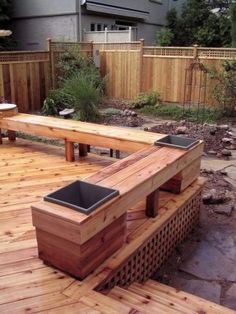 a wooden bench sitting on top of a wooden deck