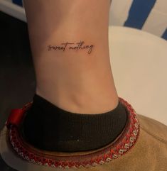 a woman's foot with the words great nothing written on her left side ribcage