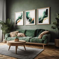 a living room with green couches and paintings on the wall