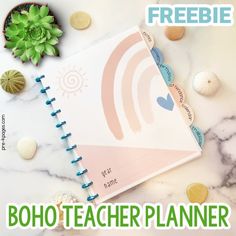 a book with the title'freebie boho teacher planner'next to shells and succulents