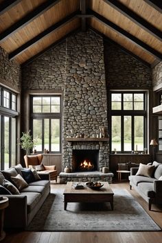 a living room filled with lots of furniture and a fire place in the middle of it