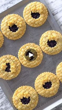 nine pies on a baking sheet with one missing the middle and six remaining in front