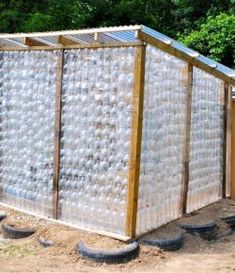 an outdoor toilet made out of plastic bottles