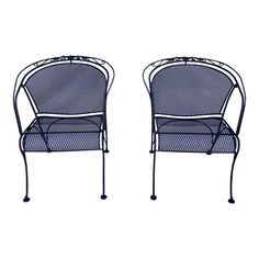 pair of wrought iron patio chairs