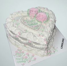 a heart shaped cake on top of a card