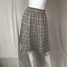 "This is a great midi skirt with a houndstooth pattern. The fabric is mid-weight polyester and the colors are fun. The waist is elastic. It's constructed of 6 panels, thoughtfully fitted. Details Size: unmarked Waist: 24\" - 32\" Hips: 42\" Length: 28\" Brand: unmarked Colors: Brown, Yellow & White Condition: Excellent, no issues." Vintage Skater, Colors Brown, Color Vintage, Houndstooth Pattern, Etsy Vintage, Skater Skirt, Yellow White, High Waisted Skirt, Midi Skirt