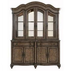 an old fashioned china cabinet with glass doors