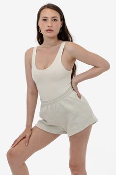 These short shorts are made of our bouncy 12 oz. cotton fleece, making them comfy, easy and versatile. Take your regular size or size up for a looser fit. This style features an elastic waistband, and a single back pocket. Try pairing with our matching sweatshirts or a neutral crop top or bodysuit. This fleece is made of a soft, combed cotton to keep you cozy and warm. Made in Los Angeles, Calif. Our experienced sewers earn up to $25 an hour and no less than $16; additionally workers have health Neutral Crop Tops, Los Angeles Apparel, Bus Pass, Matching Sweatshirts, Fleece Shorts, Short Shorts, Cotton Fleece, Combed Cotton, Loose Fitting