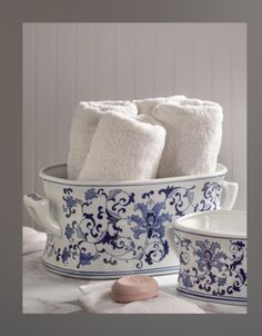 blue and white bath accessories in a bowl