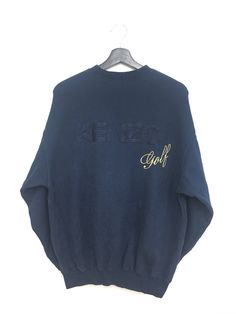 "SVS 001  Rare Vintage KENZO GOLF Sweatshirt Big Logo Embroidery Pullover Navy Blue Color SIZE ON TAG ( 3 ) MEASURES ABOUT (APPROXIMATELY) : - ARMPIT TO ARMPIT: 22.5 inch - LENGTH (BACK COLLAR DOWN): 26 inch Please check the measurement carefully before make a purchase.. This is used clothing. Please don't expected it to be like new or in pristine condition.. thanks. ----------------------------------- Shipping Cost :  $20 for Worldwide Shipping . Receiving the item within 14-21 business days. Pull Bleu Marine, Golf Sweatshirt, Kenzo Sweatshirt, Vintage Outfits 90s, Soft Pink Color, College Sweatshirt, Embroidery Sweatshirt, Adidas Sweatshirt, Branded Sweatshirts