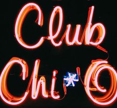 a neon sign with the words club chi - o written in chinese and english on it