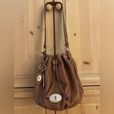 Fossil Light Brown Shoulder Bag ,Cow Leather In Very Good Condition Fossil Shoulder Bag, Fossil Handbags Fossil Germany, Brown Crossbody Bag Fossil, Brown Satchel Shoulder Bag With Silver-tone Hardware, Cheap Brown Shoulder Bag With Silver-tone Hardware, Fossil Bags, Brown Shoulder Bag, Light Brown, Cow Leather